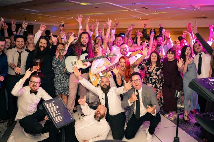 The Good Times with Harry and his wedding guests, arms in the air on the dance floor